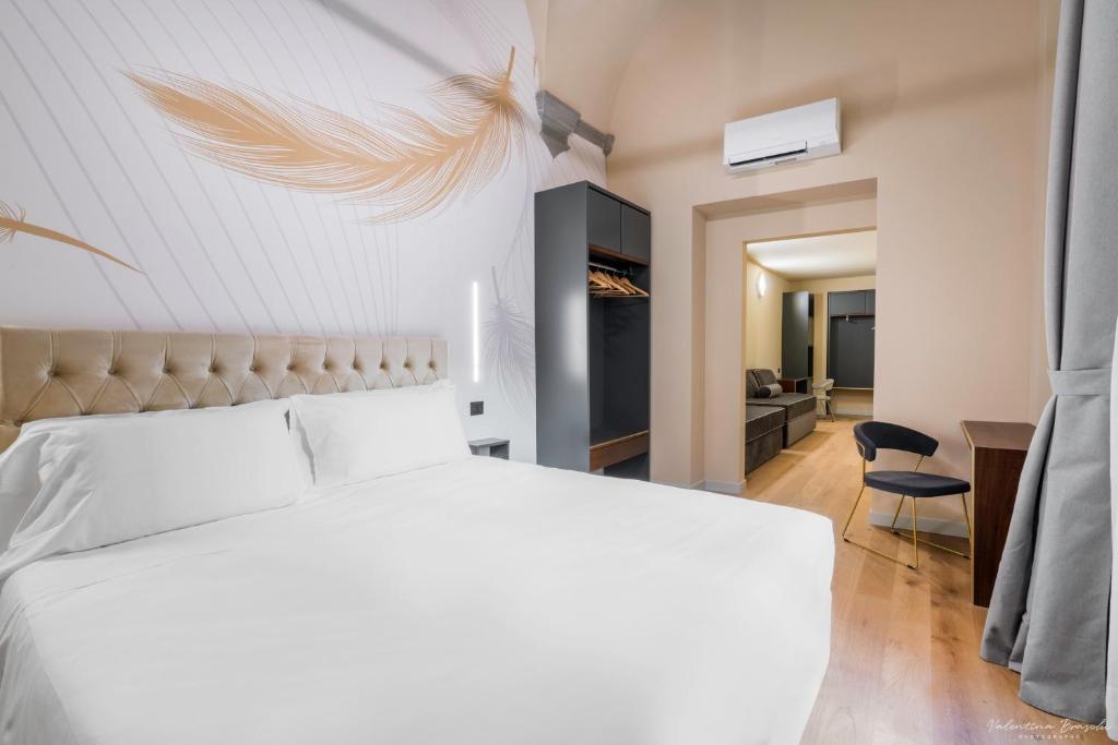 Postel nebo postele na pokoji v ubytování Hotel Adamas