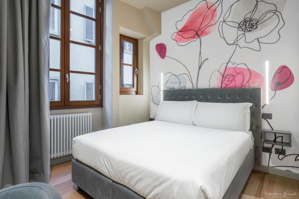Postel nebo postele na pokoji v ubytování Hotel Adamas