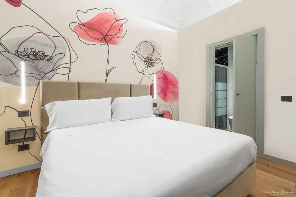 Postel nebo postele na pokoji v ubytování Hotel Adamas
