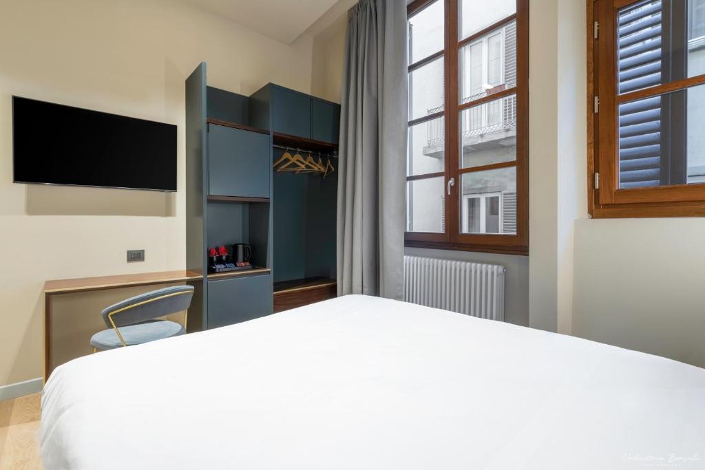 Postel nebo postele na pokoji v ubytování Hotel Adamas
