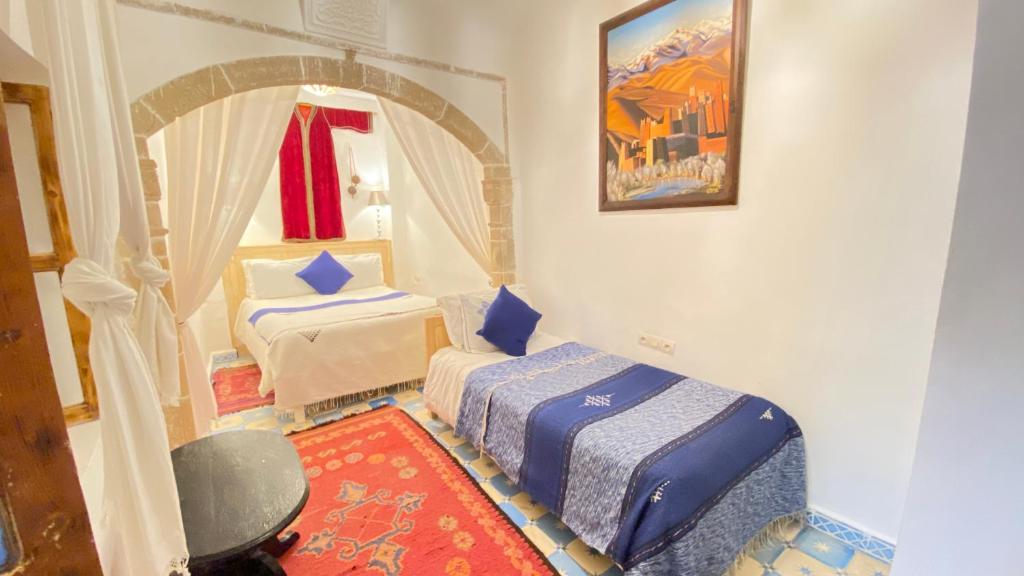 Postel nebo postele na pokoji v ubytování Riad Azul