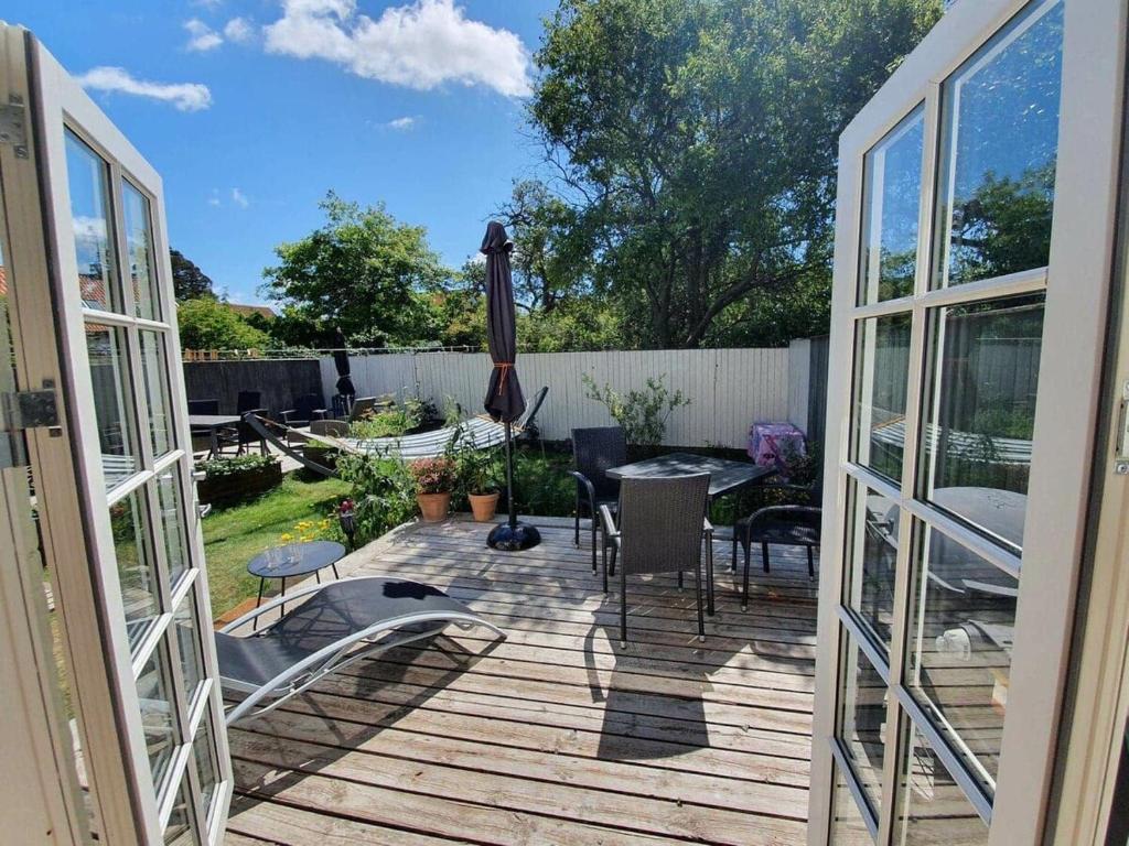 a view of a patio with a table and chairs at Well Design apartment in Rønne in Rønne
