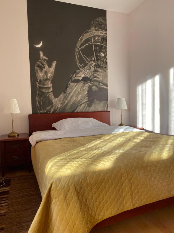 Postel nebo postele na pokoji v ubytování Hotel Uniwersytecki