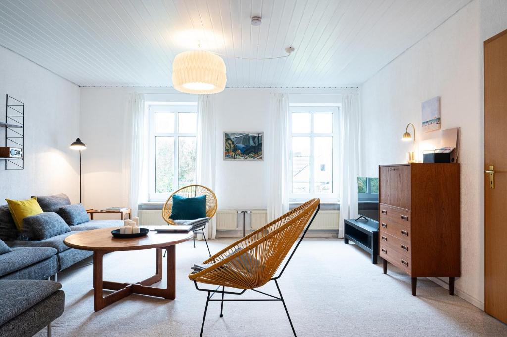 a living room with a couch and a table at Ferienwohnung Groote Stuuv - Stein in Stein