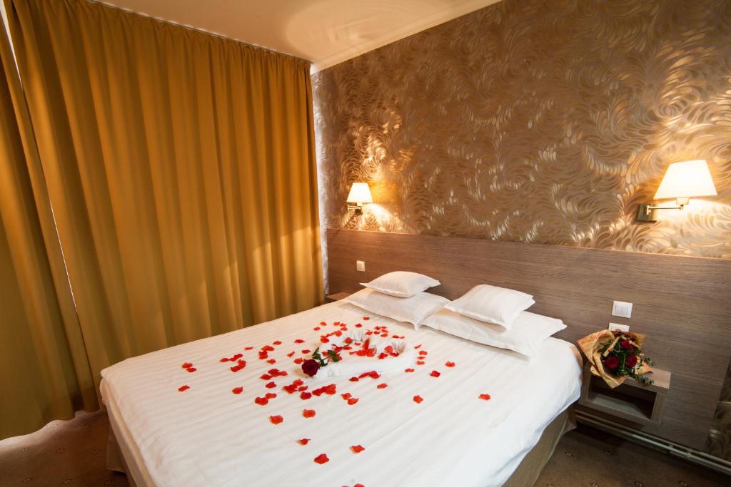 Postel nebo postele na pokoji v ubytování Hotel Stil