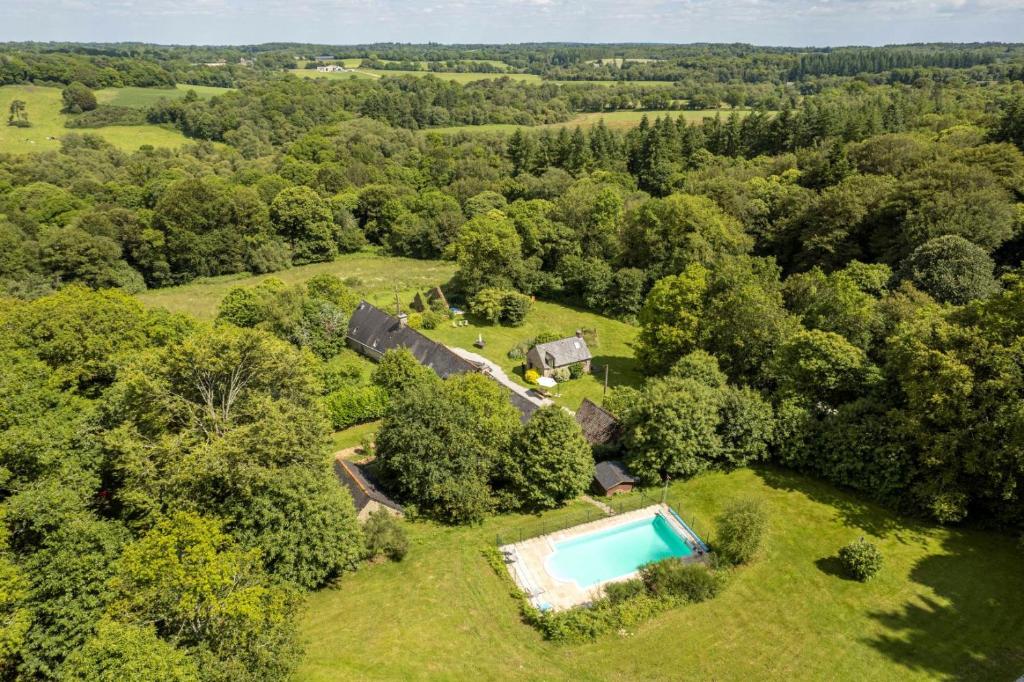 an aerial view of an estate with a swimming pool at FORET TOTEM - Hébergements nature et bien-être en pleine forêt in Persquen