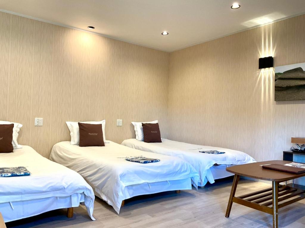Postel nebo postele na pokoji v ubytování Ducale Garden Hotel Kujukuri
