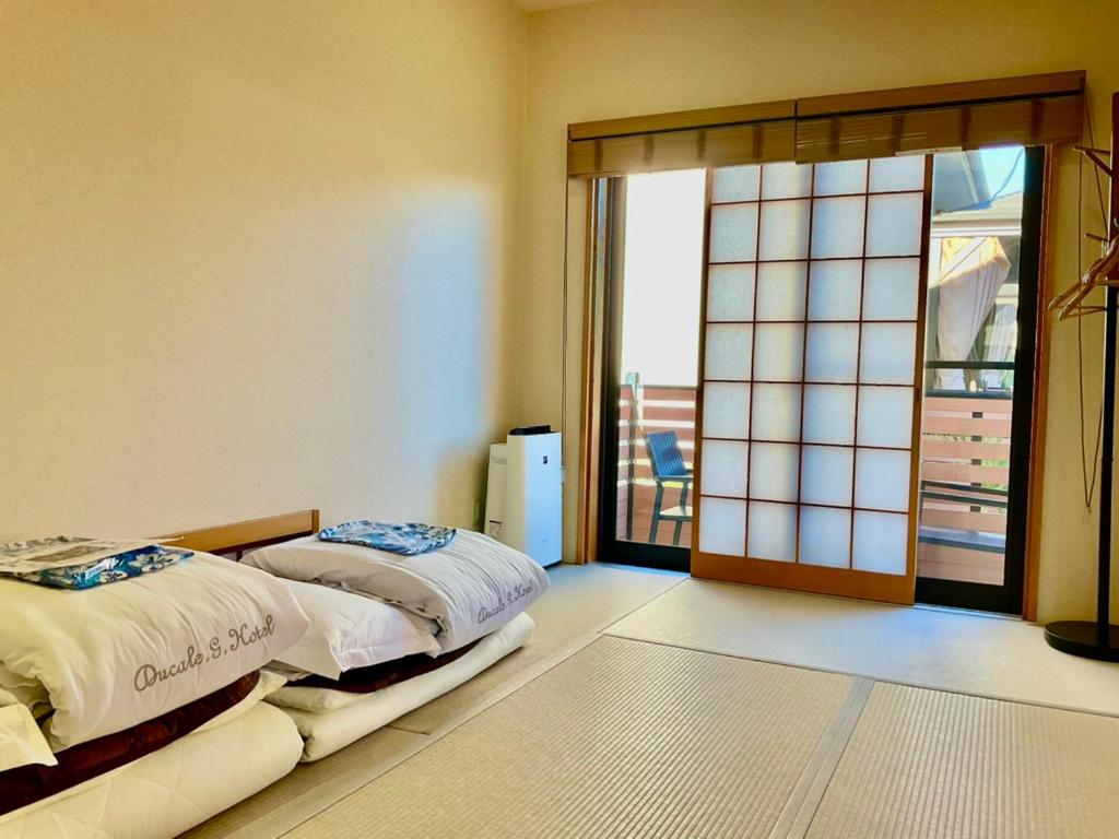 Postel nebo postele na pokoji v ubytování Ducale Garden Hotel Kujukuri