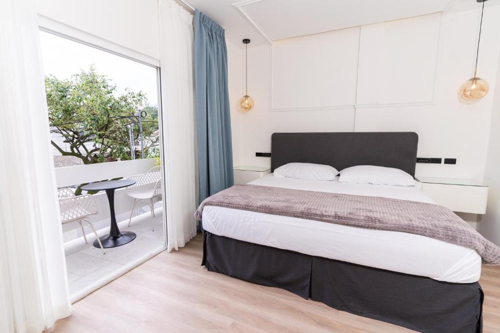 Postel nebo postele na pokoji v ubytování Hotel Boutique Las Mesetas