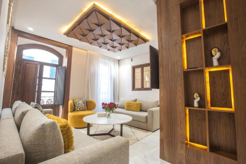 a living room with a couch and a table at KH APPARTEMENT appart1 in Essaouira
