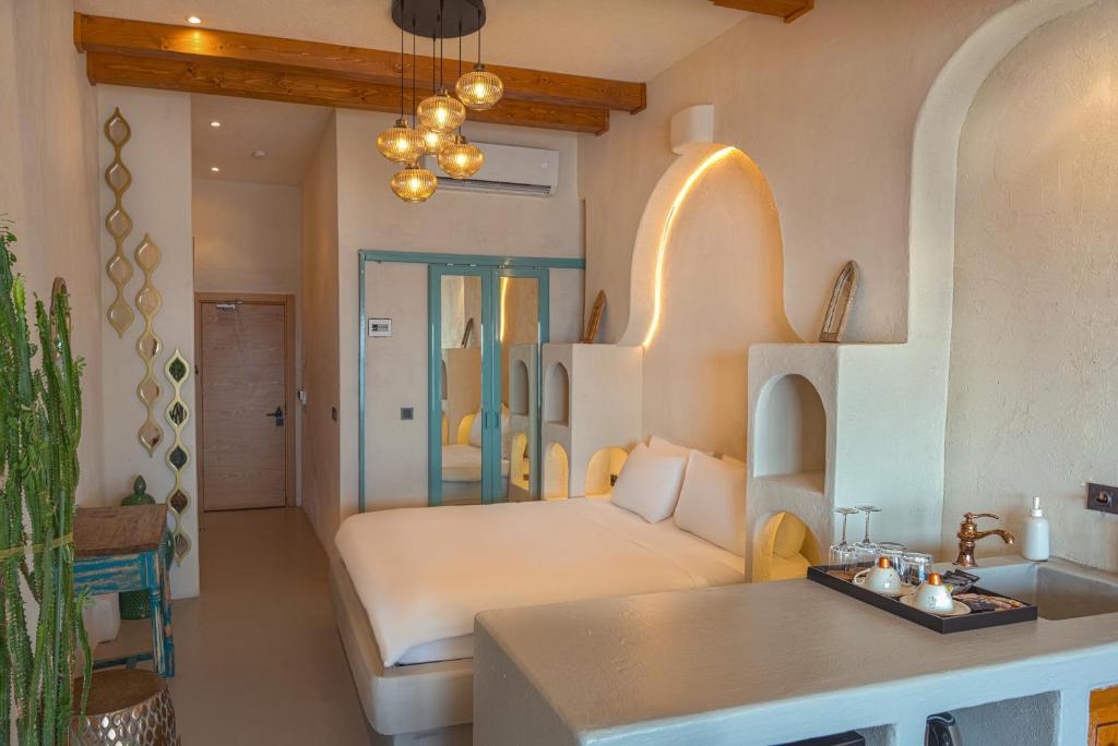 a living room with a bed and a table at Churchill Townhouse in Bodrum City