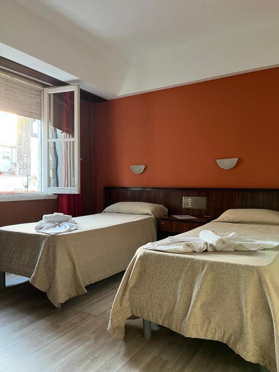 Ένα ή περισσότερα κρεβάτια σε δωμάτιο στο Hotel Flamingo