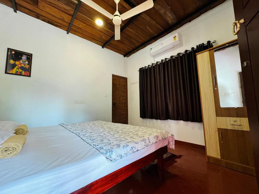 Postel nebo postele na pokoji v ubytování Marari Helen Villa