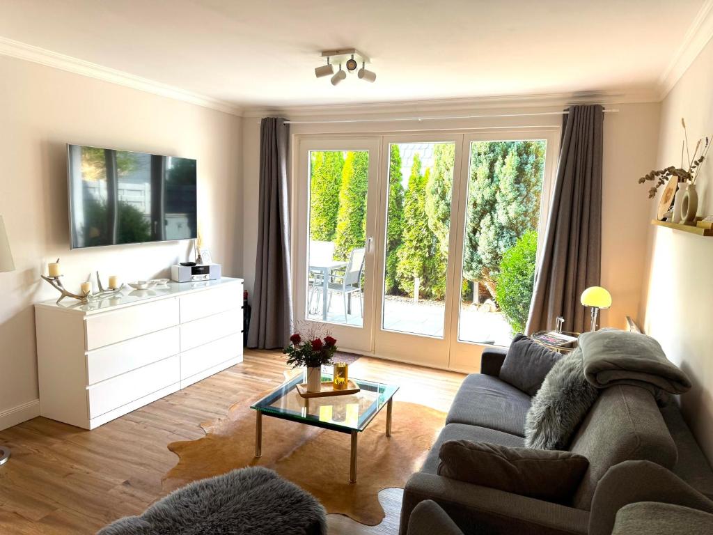 a living room with a couch and a table at Ferienwohnung Wolke 7 in Bad Harzburg in Bad Harzburg