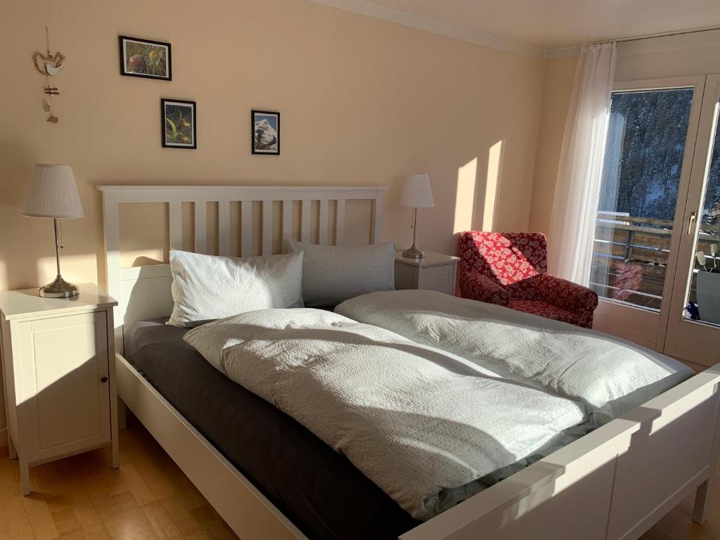 Postel nebo postele na pokoji v ubytování Ferienwohnung Sotcha 8c