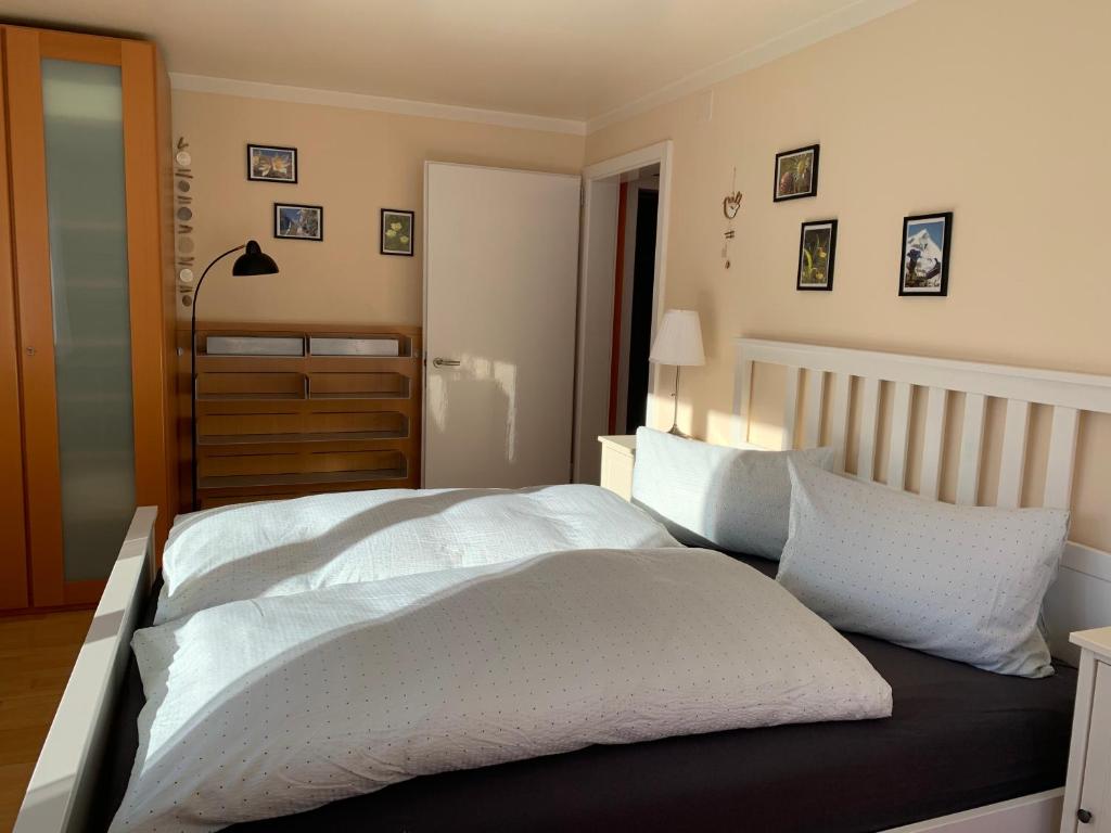 Postel nebo postele na pokoji v ubytování Ferienwohnung Sotcha 8c