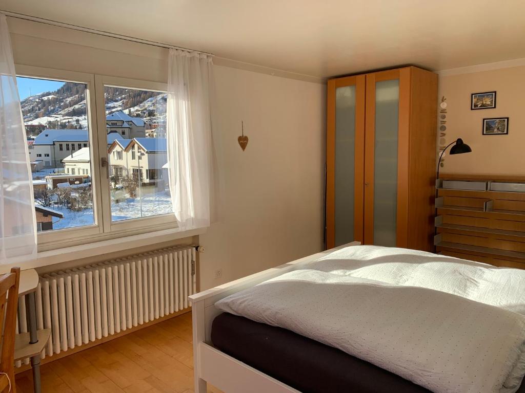 Postel nebo postele na pokoji v ubytování Ferienwohnung Sotcha 8c