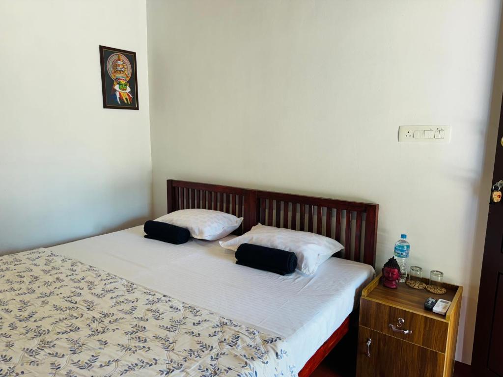 Postel nebo postele na pokoji v ubytování Marari Helen Villa