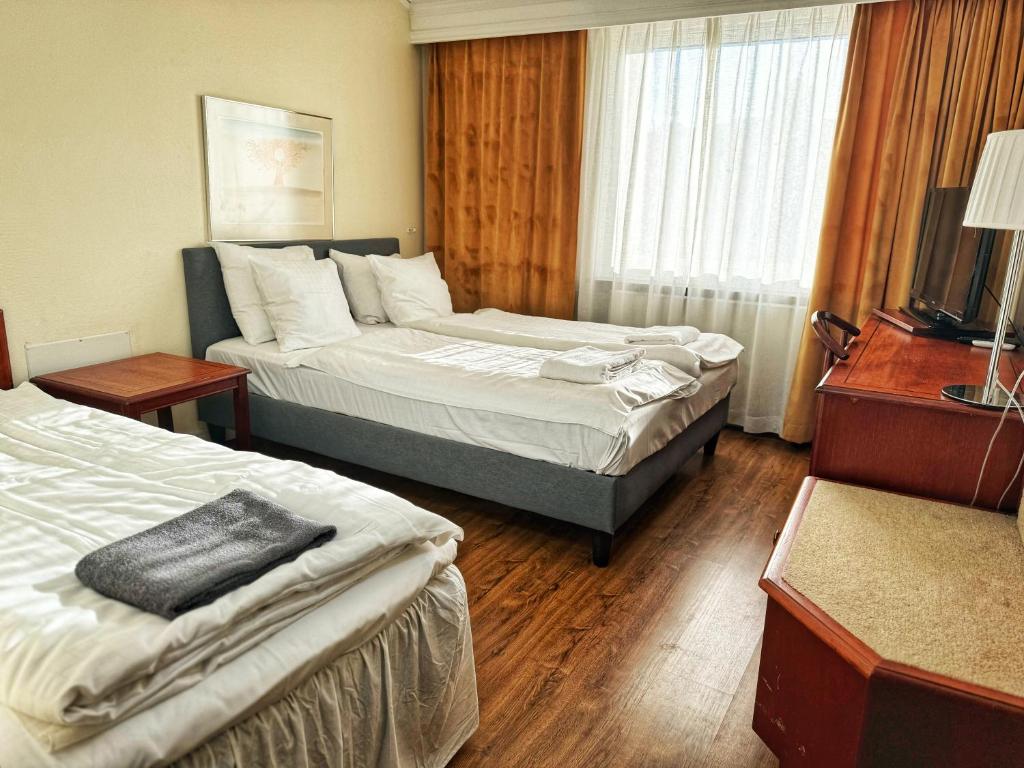 Postel nebo postele na pokoji v ubytování Hotel Fars Hatt