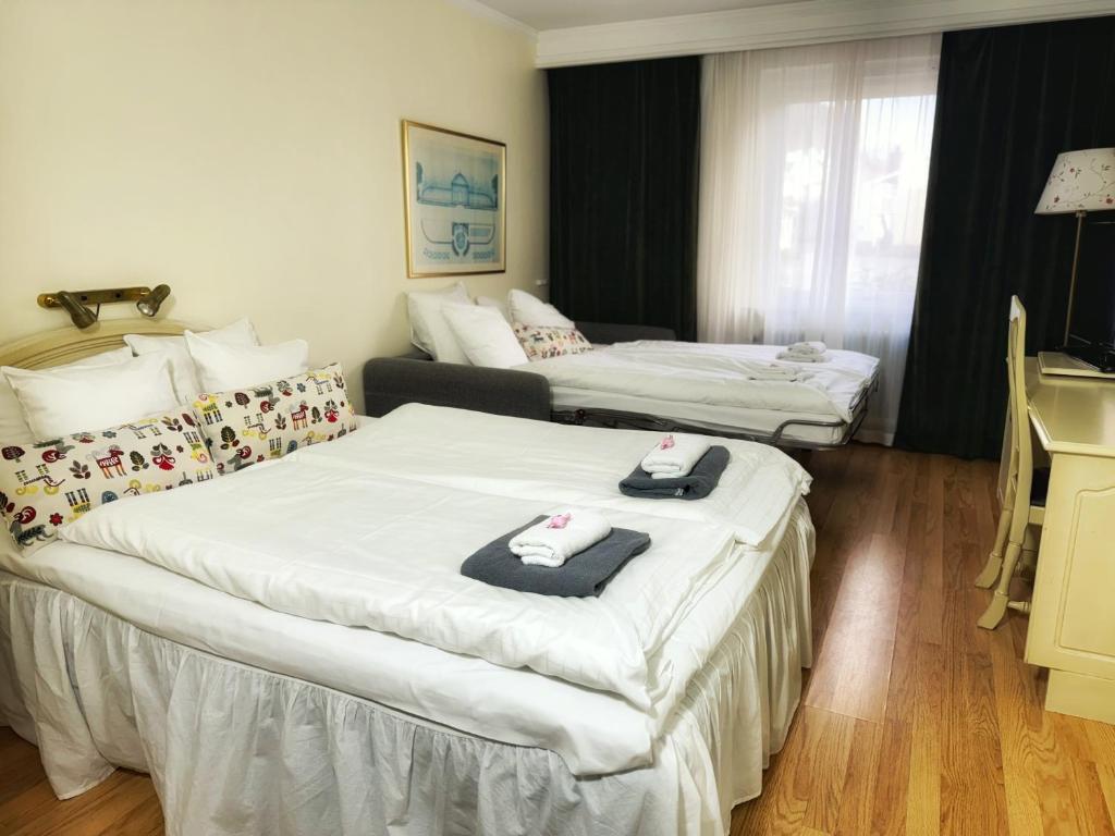Postel nebo postele na pokoji v ubytování Hotel Fars Hatt