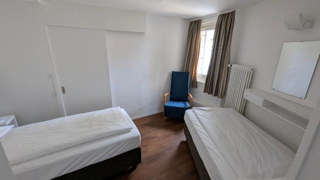 Postel nebo postele na pokoji v ubytování Hotel De la Paix