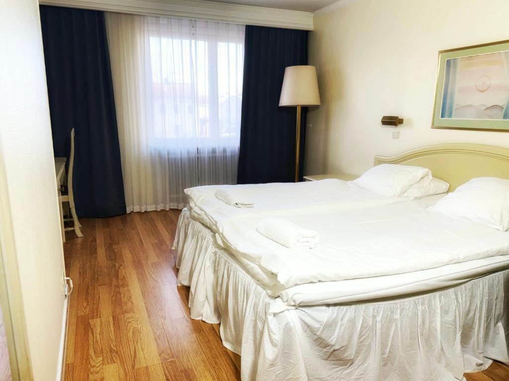 Postel nebo postele na pokoji v ubytování Hotel Fars Hatt