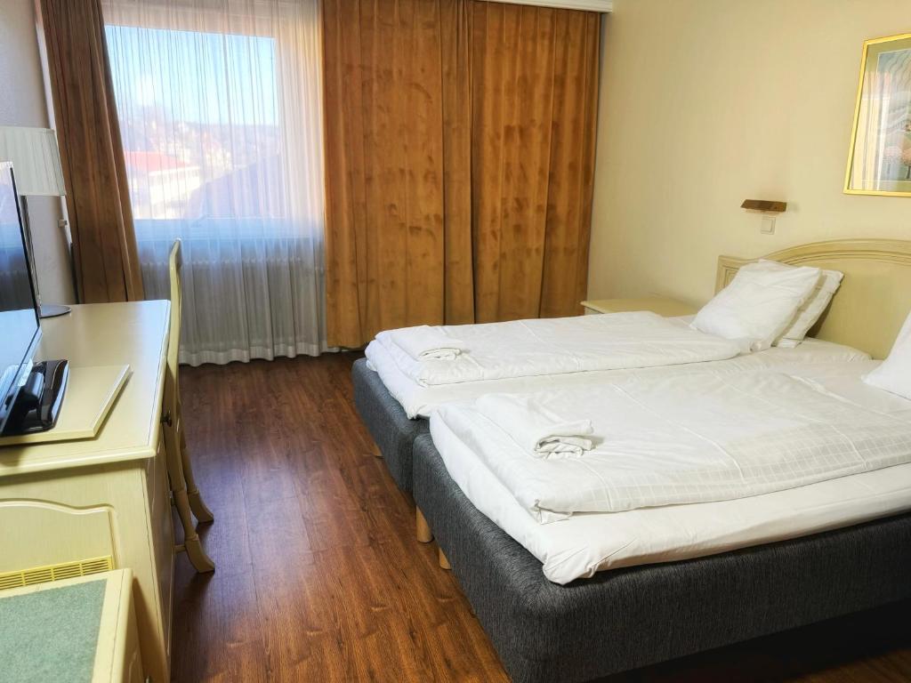Postel nebo postele na pokoji v ubytování Hotel Fars Hatt
