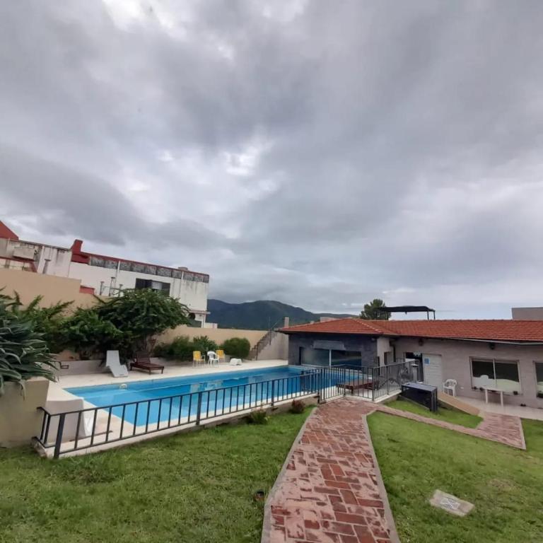 an image of a swimming pool at a house at Posada Spa Anabela in Huerta Grande