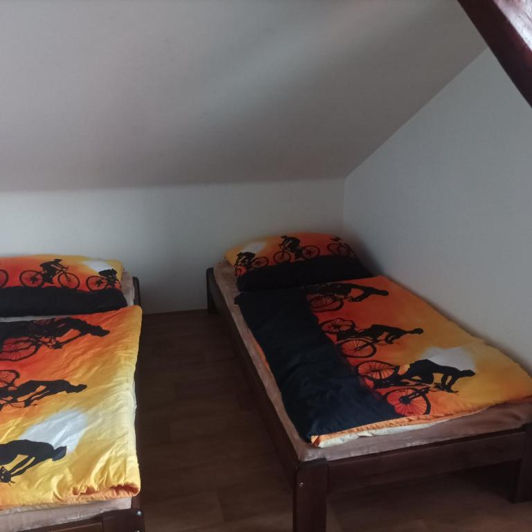 Postel nebo postele na pokoji v ubytování Hostinec U Koláče
