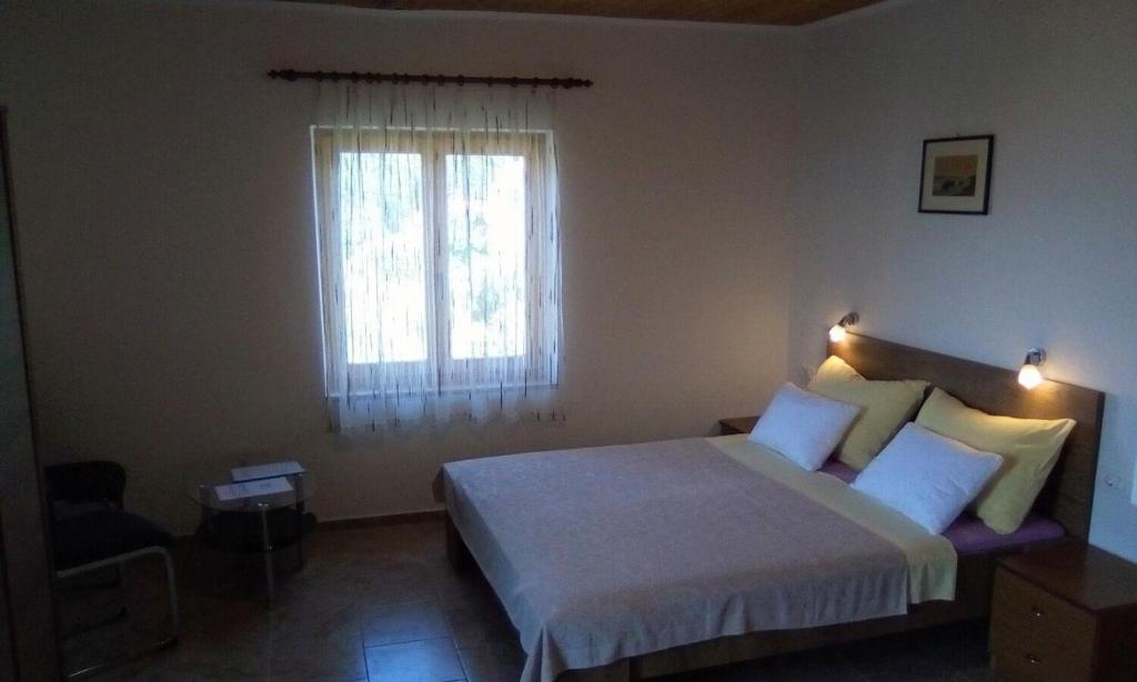 Postel nebo postele na pokoji v ubytování Apartment Griv