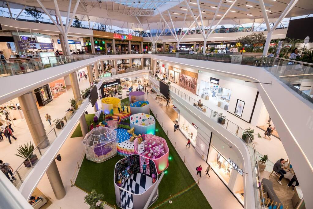 an overhead view of a shopping mall with people in it at Party house, poblado, Movie Theater, Terrace in Envigado