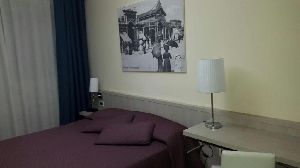Postel nebo postele na pokoji v ubytování Hotel Bella Riviera Lungomare