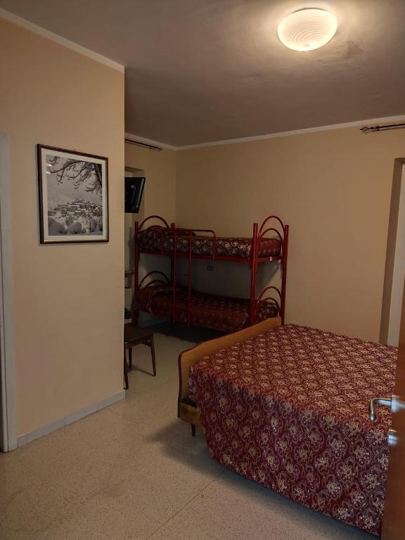 Postel nebo postele na pokoji v ubytování Albergo Seggiovia