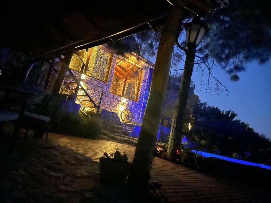 a building with lights on it at night at Casa de ensueño in Villa Carlos Paz