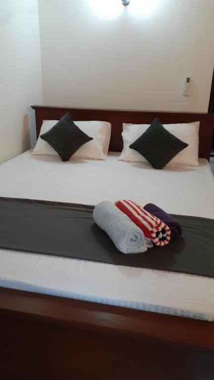 Postel nebo postele na pokoji v ubytování Jithu homestay Mirissa