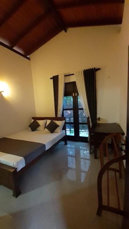 Postel nebo postele na pokoji v ubytování Jithu homestay Mirissa