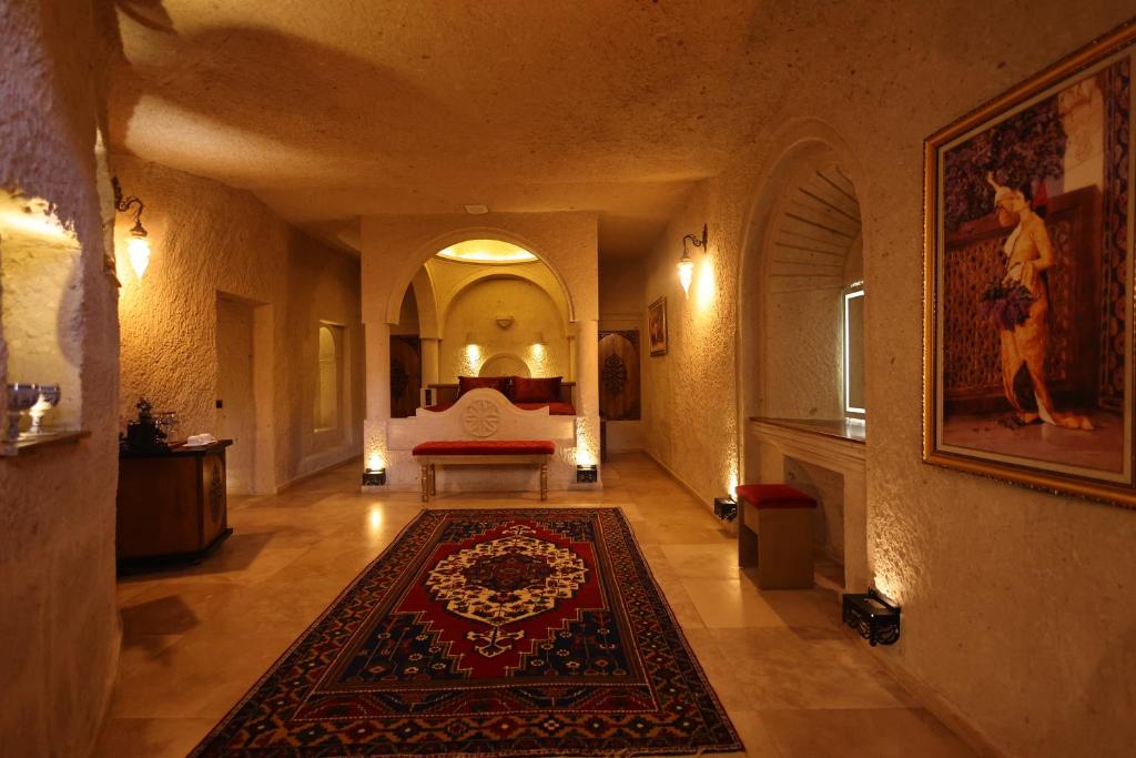 A bed or beds in a room at Cappadocia Inn Cave Hotel