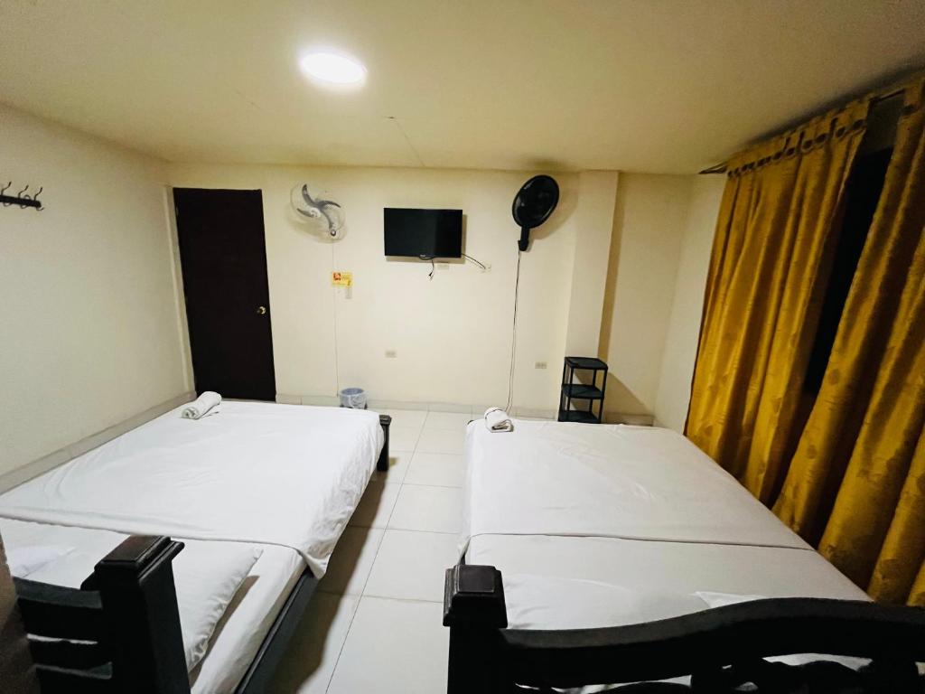 Uma cama ou camas num quarto em Merkezi Saray
