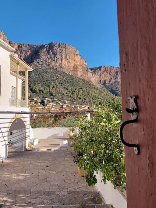 a building with a view of a mountain at Erika's home in Leonidio