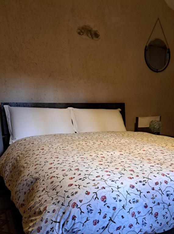 Postel nebo postele na pokoji v ubytování Appartamento in Corte Storica