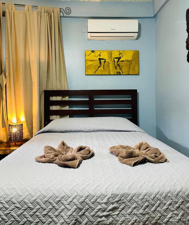 Postel nebo postele na pokoji v ubytování Hotel Boruca Tamarindo