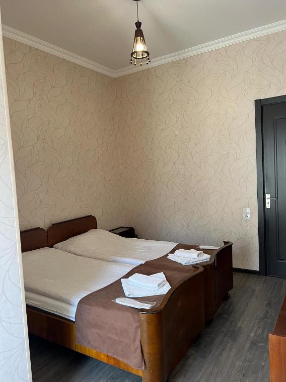 Postel nebo postele na pokoji v ubytování Arsukidze guesthouse