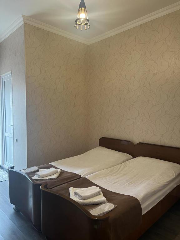 Postel nebo postele na pokoji v ubytování Arsukidze guesthouse