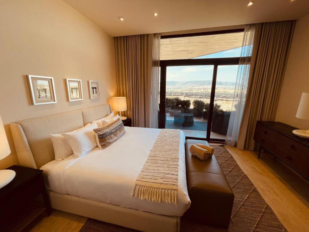 Postel nebo postele na pokoji v ubytování Casa Raíces Hotel Luxury & Viñedo