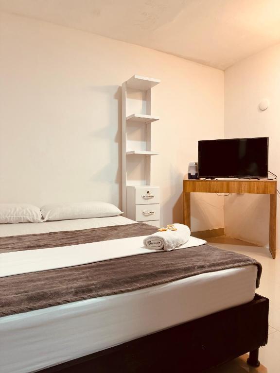 Postel nebo postele na pokoji v ubytování Hotel Coffee Real Pereira