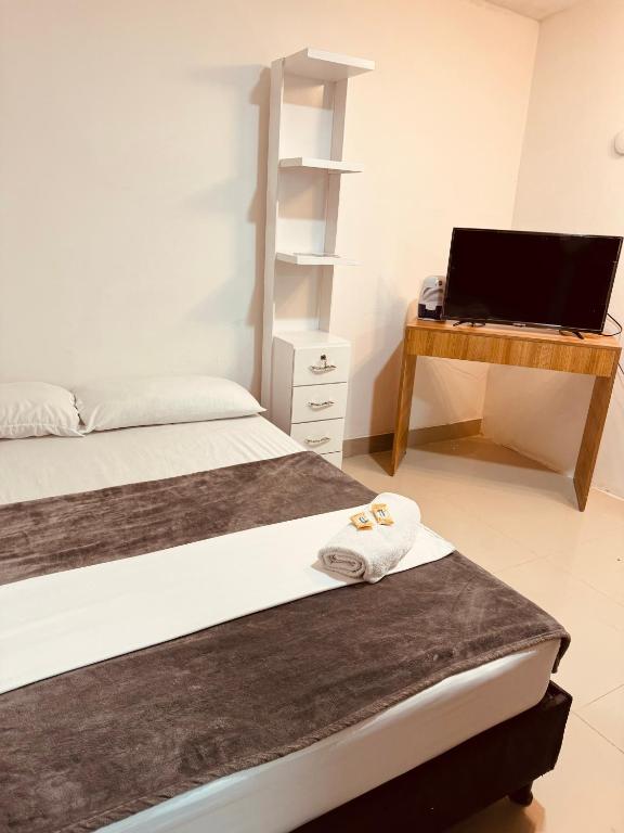 TV a/nebo společenská místnost v ubytování Hotel Coffee Real Pereira