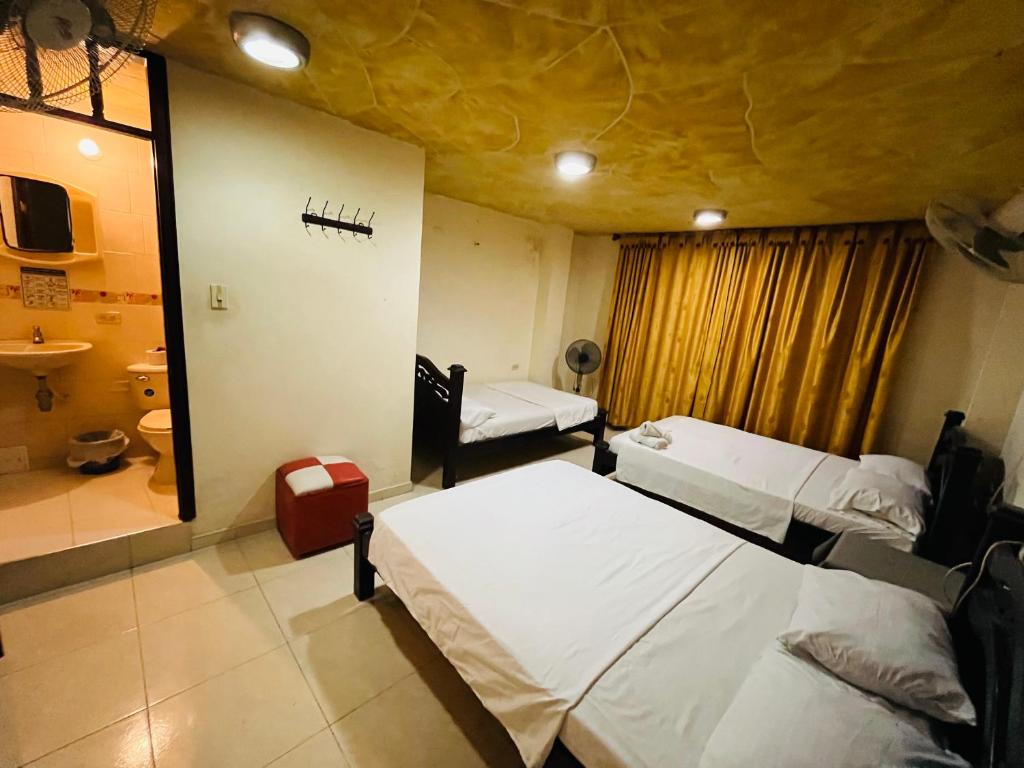 Uma cama ou camas num quarto em Merkezi Saray