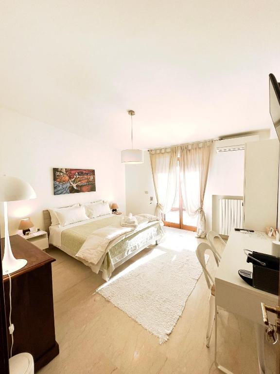 Postel nebo postele na pokoji v ubytování B&B Le Saline