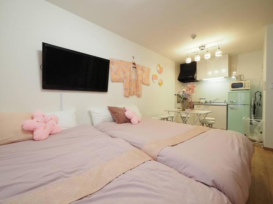 Postel nebo postele na pokoji v ubytování Guest Room Ichigo