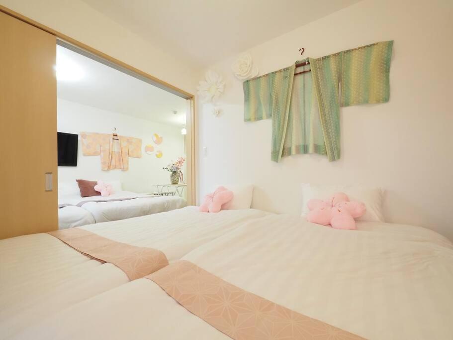 Postel nebo postele na pokoji v ubytování Guest Room Ichigo